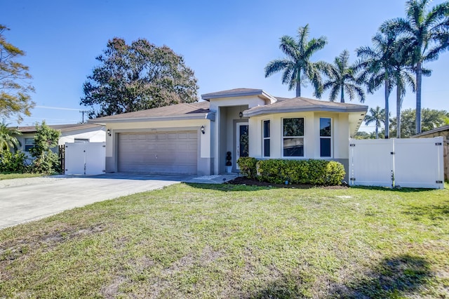 view of front of home featuring a garage and a front yard