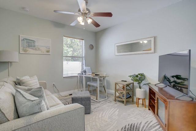 interior space with light colored carpet and ceiling fan