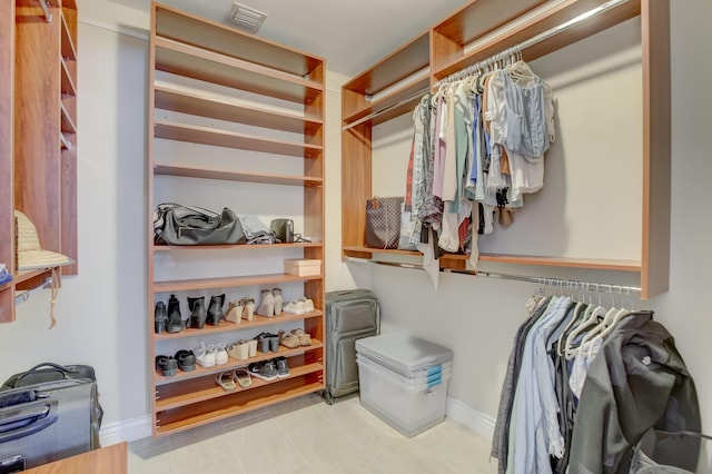 spacious closet featuring light tile patterned flooring