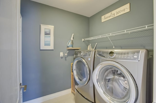 clothes washing area with independent washer and dryer