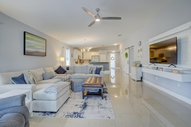 living room featuring vaulted ceiling and ceiling fan with notable chandelier