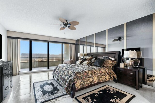 100 Lakeshore Dr Unit 252, North Palm Beach, FL 33408 - bedroom featuring ceiling fan and a textured ceiling