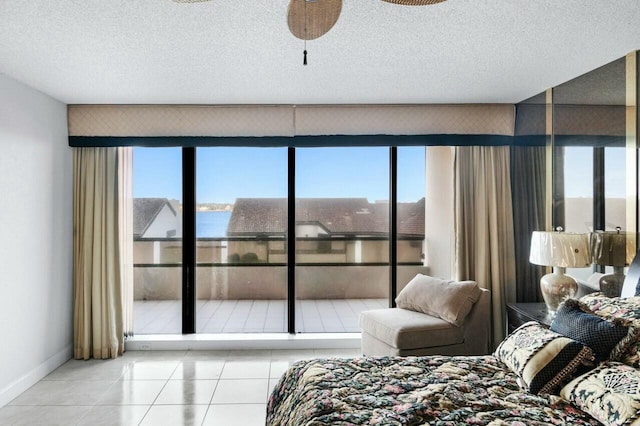 100 Lakeshore Dr Unit 252, North Palm Beach, FL 33408 - tiled bedroom with a textured ceiling and a water view