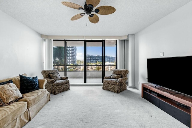 100 Lakeshore Dr Unit 252, North Palm Beach, FL 33408 - living room featuring a textured ceiling, ceiling fan, and carpet