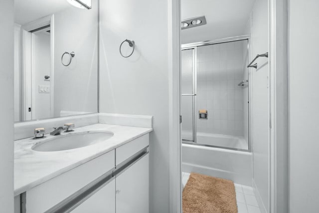 100 Lakeshore Dr Unit 252, North Palm Beach, FL 33408 - bathroom featuring bath / shower combo with glass door, tile patterned floors, and vanity