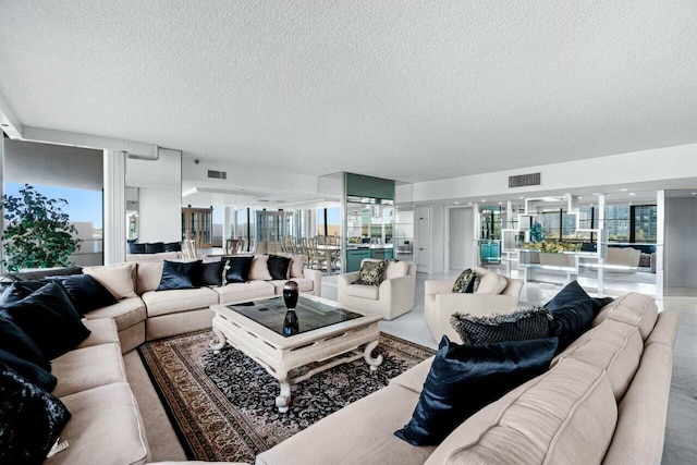 100 Lakeshore Dr Unit 252, North Palm Beach, FL 33408 - living room with a textured ceiling