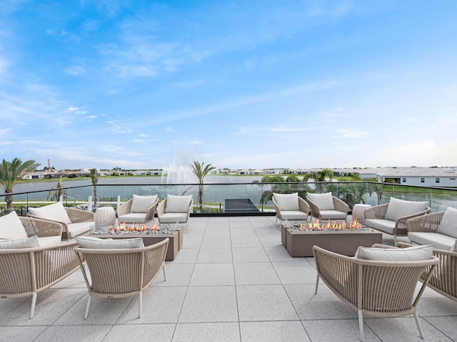 view of patio / terrace with outdoor lounge area and a water view