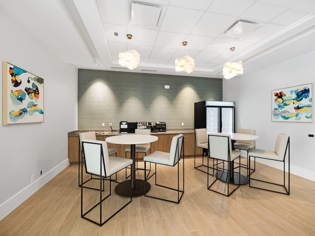 dining area with light hardwood / wood-style floors