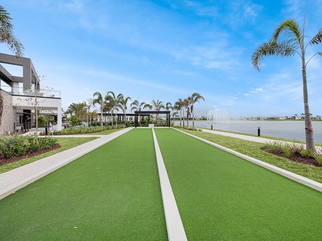 surrounding community with a water view