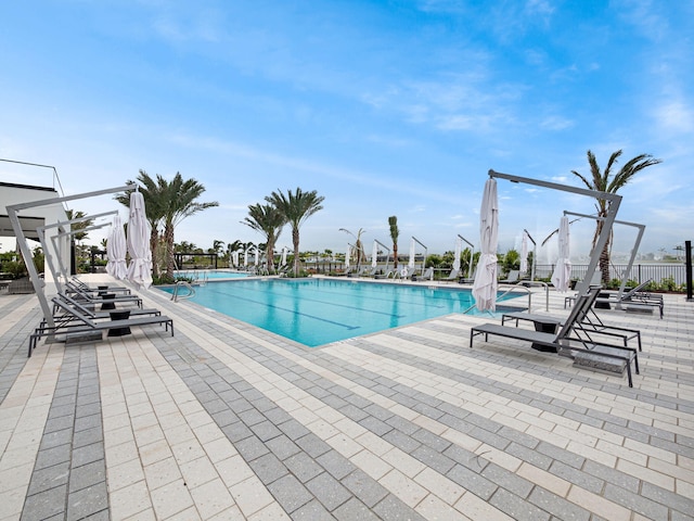 view of swimming pool featuring a patio area