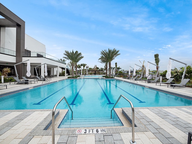 view of pool featuring a patio