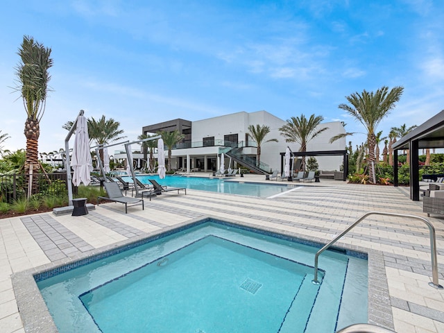 view of swimming pool with a patio