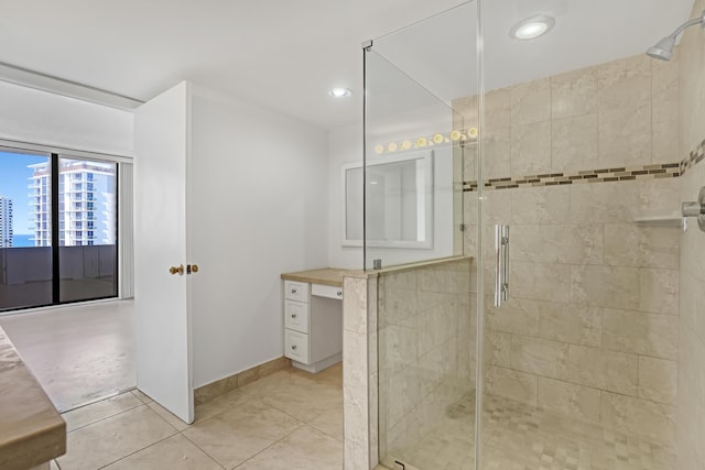 bathroom with tile patterned floors and walk in shower