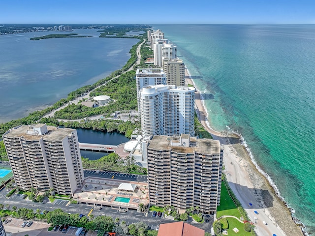 drone / aerial view featuring a view of the beach and a water view