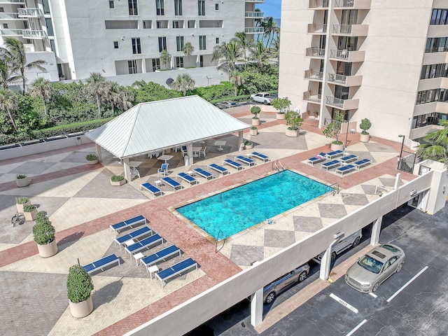 view of swimming pool with a gazebo and a patio area