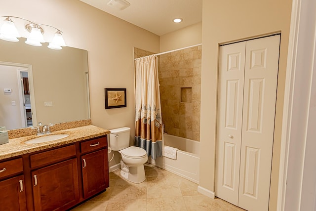 full bathroom with vanity, toilet, and shower / bath combo with shower curtain