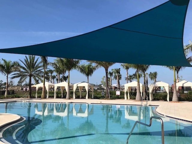 view of swimming pool featuring a gazebo and a patio area