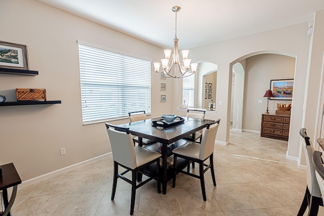 dining space featuring light tile patterned floors