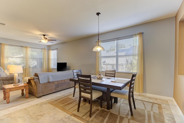 dining area with ceiling fan