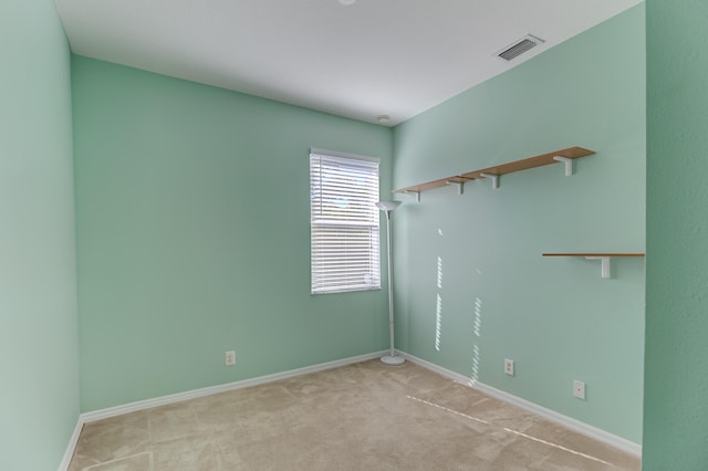 empty room with light colored carpet