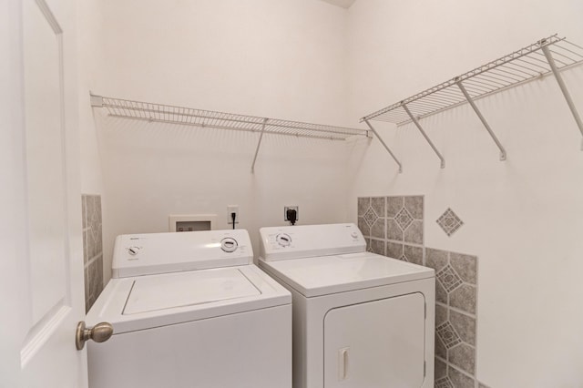 laundry area with washing machine and dryer