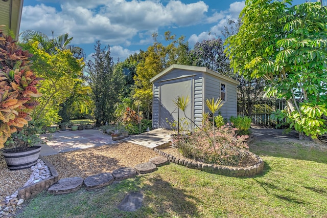 view of outbuilding with a yard