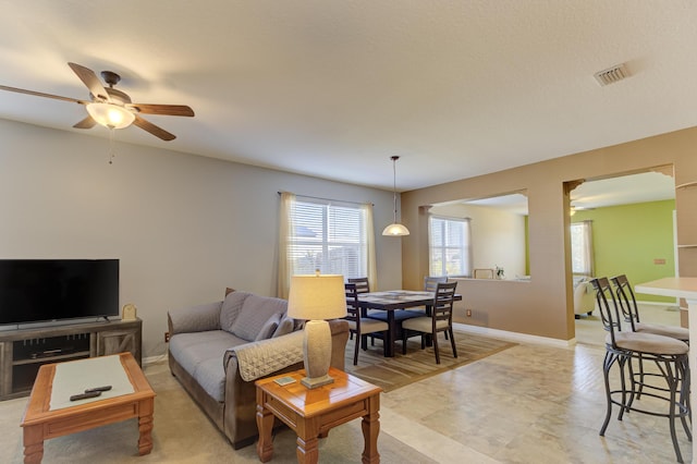 living room with ceiling fan