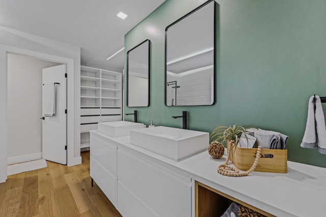 bathroom featuring vanity and hardwood / wood-style flooring