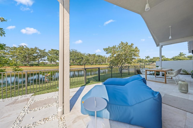 view of patio featuring a water view