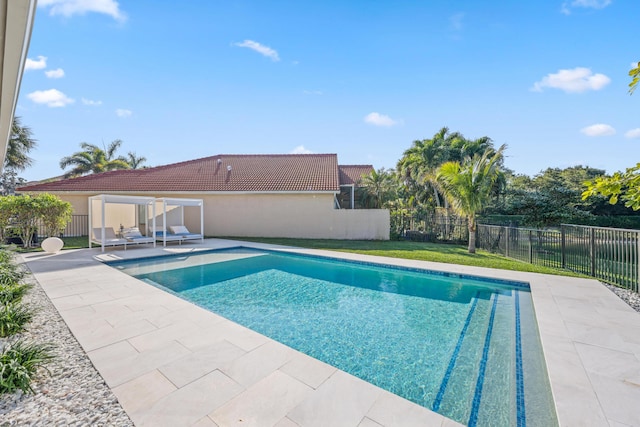 view of swimming pool with a patio area