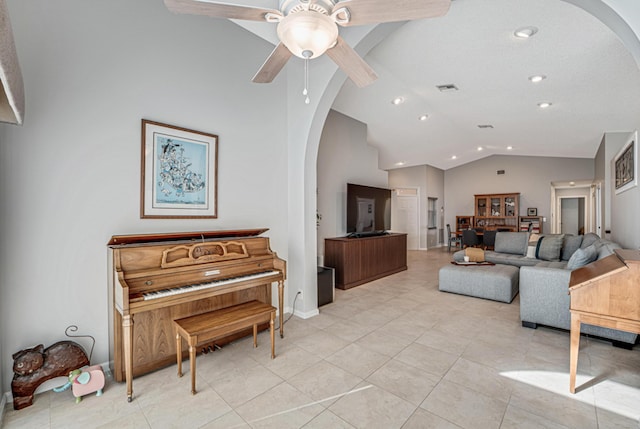 tiled living room featuring vaulted ceiling and ceiling fan