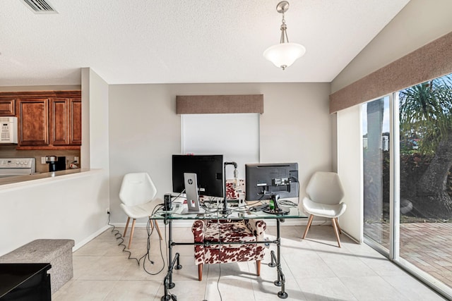 tiled home office featuring a textured ceiling and lofted ceiling