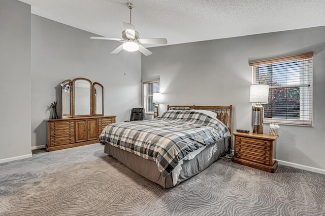 carpeted bedroom with ceiling fan, a textured ceiling, and lofted ceiling