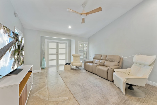 living room with lofted ceiling, french doors, and ceiling fan