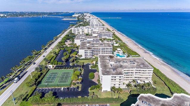 bird's eye view featuring a view of the beach and a water view