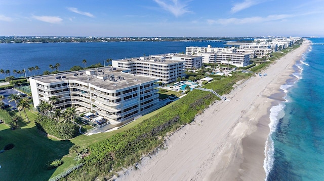 bird's eye view with a water view and a view of the beach