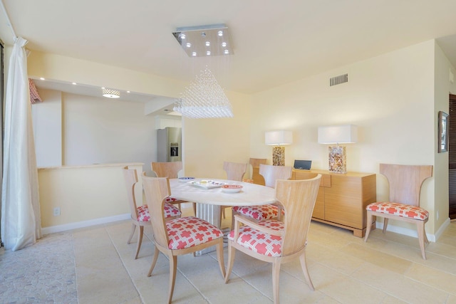 dining area featuring light tile patterned floors