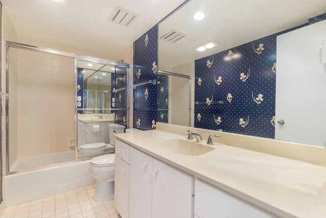 full bathroom featuring toilet, tile patterned flooring, washtub / shower combination, and vanity