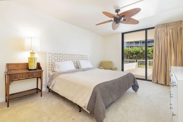 bedroom with ceiling fan, light colored carpet, access to exterior, and floor to ceiling windows