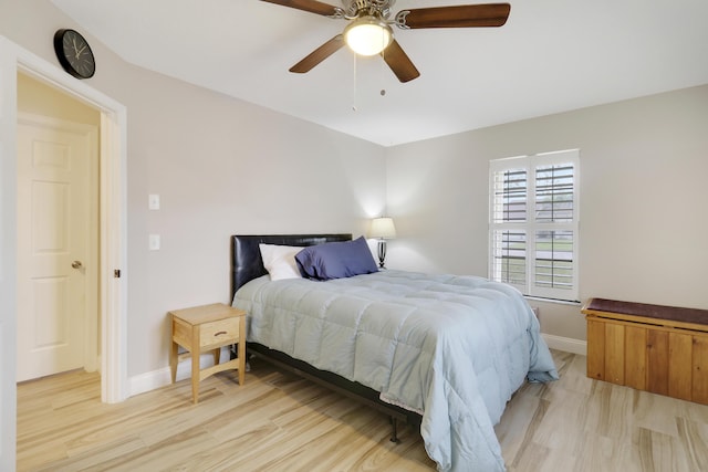 bedroom featuring light hardwood / wood-style floors and ceiling fan