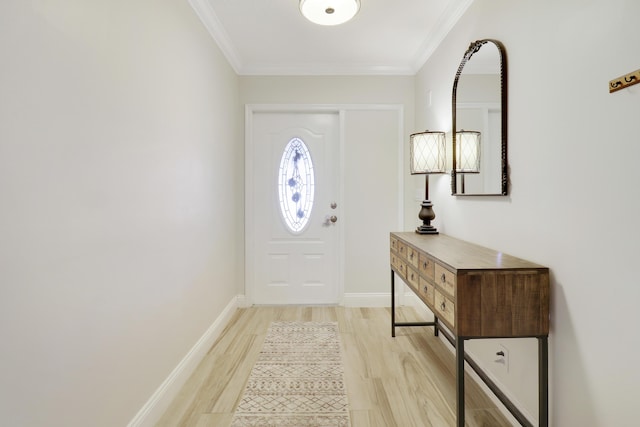 entryway with crown molding and light hardwood / wood-style floors