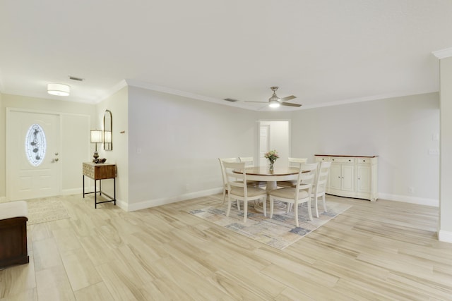 dining room with ornamental molding, ceiling fan, and light hardwood / wood-style flooring