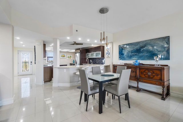 dining area featuring light tile patterned floors