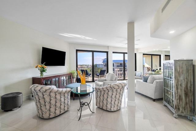 tiled living room with ceiling fan