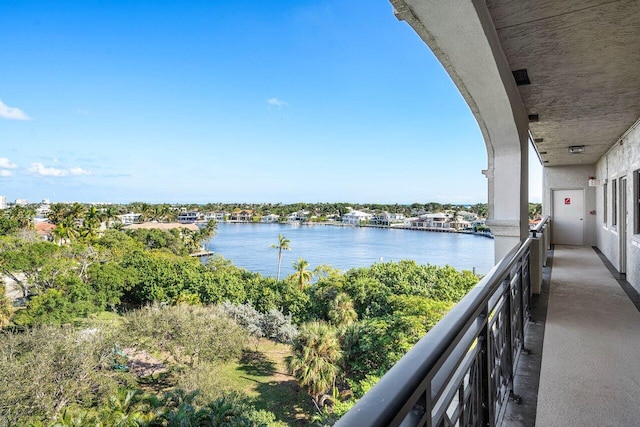 balcony featuring a water view