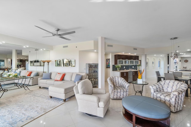 living room with light tile patterned floors and ceiling fan