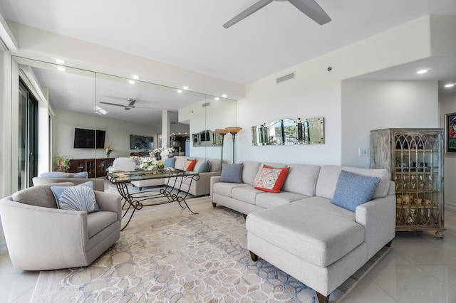 living room featuring ceiling fan and vaulted ceiling