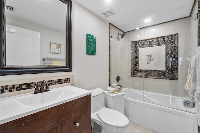 full bathroom featuring combined bath / shower with glass door, backsplash, tile patterned flooring, vanity, and toilet