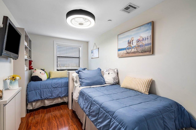 bedroom featuring dark hardwood / wood-style floors