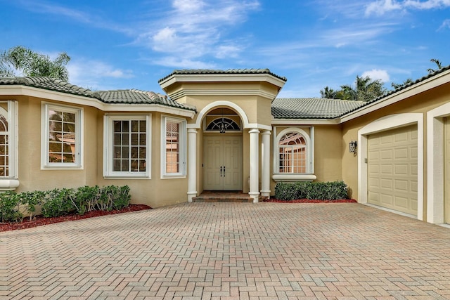 doorway to property featuring a garage